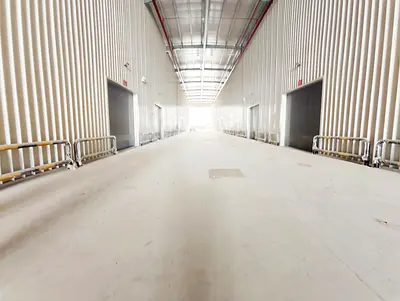 SPACIOUS INDUSTRIAL WAREHOUSE FOR RENT IN SHARJAH FEATURING HIGH CEILINGS HEAVY POWER CAPACITY EASY LOADING DOCK ACCESS AND PRIME LOCATION NEAR MAIN HIGHWAYS