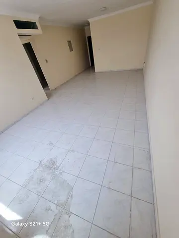 For rent in Sharjah Al Majaz 2 two bedroom apartment with hall two bathrooms spacious central AC paid by owner for employees only annual rent AED 5250