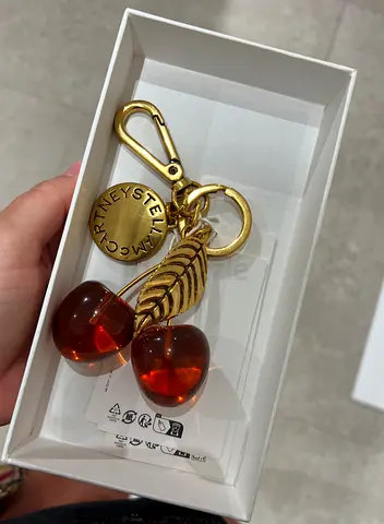 Stella McCartey Gold-tone cherry bag charm/keychain (new, in box)