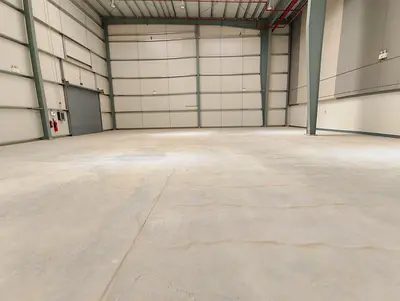 SPACIOUS INDUSTRIAL WAREHOUSE FOR RENT IN SHARJAH FEATURING HIGH CEILINGS HEAVY POWER CAPACITY EASY LOADING DOCK ACCESS AND PRIME LOCATION NEAR MAIN HIGHWAYS