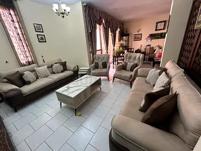 Beige 4-piece sofa set with armchairs and marble-look coffee table