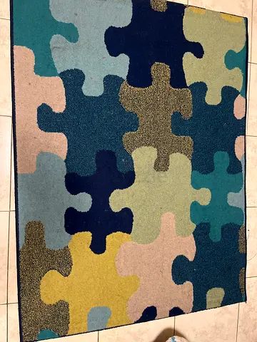 Puzzle-pattern multicolor rug - good condition