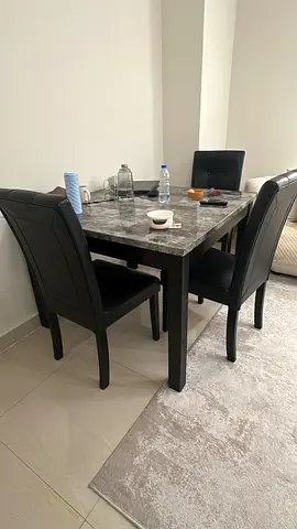 4-Seater Marble Top Dining Table with Black Faux Leather Chairs