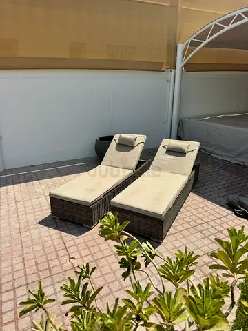 Outdoor rattan sun lounger x2  with cushion - good condition 1 year old by Mazelounge