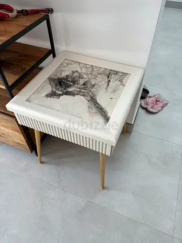 Modern white and wood bedside table with brass legs
