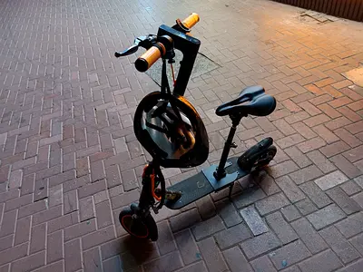 Electric scooter with added seat and helmet - good working condition
