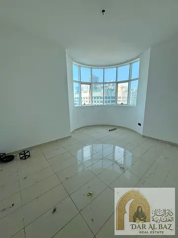 Apartment for annual rent in Al Qasba, one bedroom and living room, with gym, swimming pool, and parking. One month free. Contract attestation is the