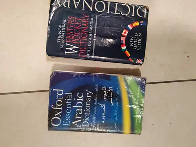 Two pocket dictionaries: Websters English Oxford Essential Arabic