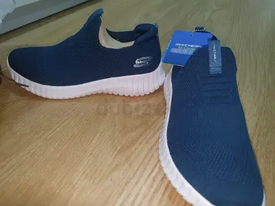 Skechers Navy Slip-On Knit Sneakers - New with Tags. 21 cm