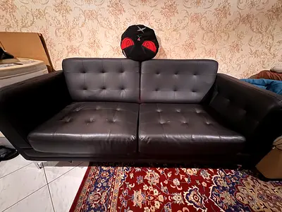 Dark black leather 3-seater sofa in good condition ( used almost 6 months only ) neat and very brand