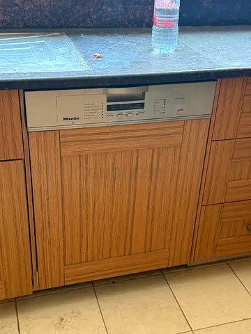Built-in Miele dishwasher integrated into kitchen cabinet - good condition