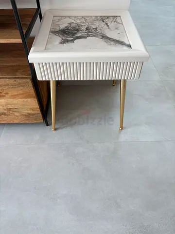 Modern white and wood bedside table with brass legs