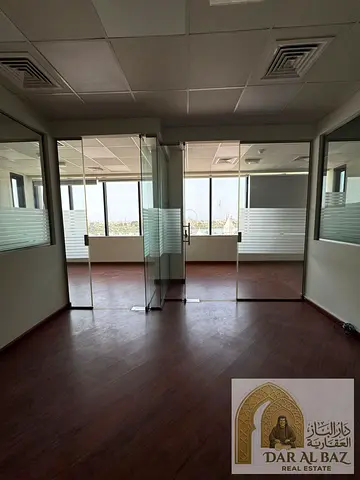 Commercial office in Al Majaz 2 with 6 months free | Well-divided space | Free air conditioning | Sea view overlooking Al Majaz Lake