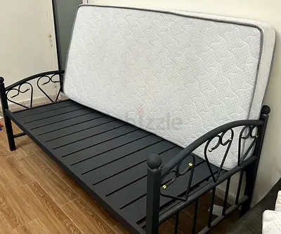 2 single beds with mattress, one heavy duty steel frame $ the other is steel  natural wood