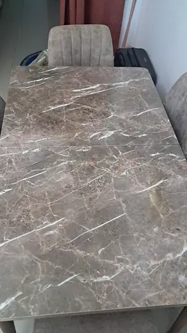 Marble-top dining table with upholstered chairs (used)
