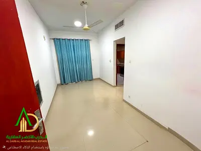 For monthly rent (unfurnished): a two-bedroom apartment with a living room on the Ajman Corniche. It boasts a prime, vibrant location close to all ame