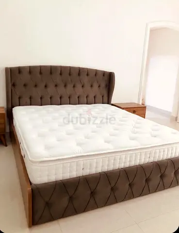 King-size upholstered bed frame with mattress - tufted headboard