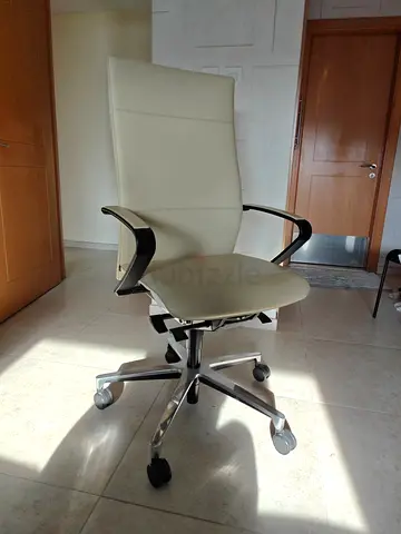 Modern high-back ergonomic office chair in light grey leather