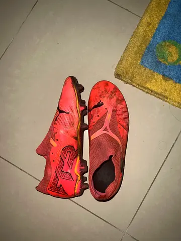 Used red football boots (cleats) - size 42, fair condition