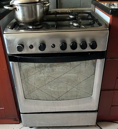 Used stainless steel gas oven and 4-burner stove - good working condition