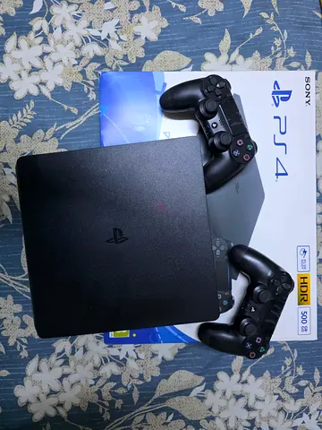 PlayStation 4 with 2 DualShock 4 Controllers - Good Condition