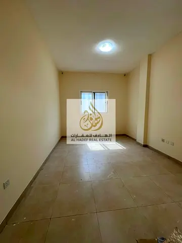 Annual rent in Ajman, Al Nuaimiya 1 area, near Al Hikma School. The building is suitable for families. It features two bedrooms and a living room, two