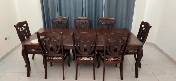 Royal teakwood 8 seater dining table. Dark wood color