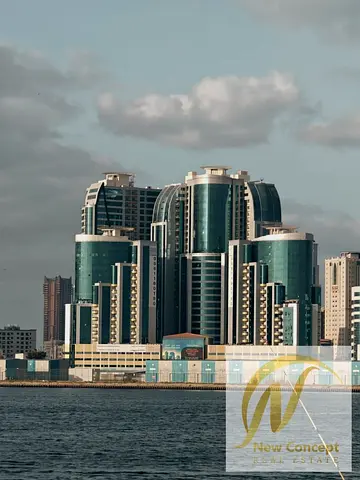 🏡 شقة غرفتين وصالة للبيع في أبراج الأورينت – عجمان | طابق مرتفع وإطلالة جزئية على الخور