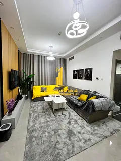 Luxury apartment, first occupancy, one bedroom and living room with a balcony and open view. Ajman,