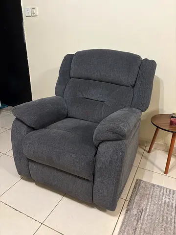 Comfortable grey fabric reclining armchair, good condition