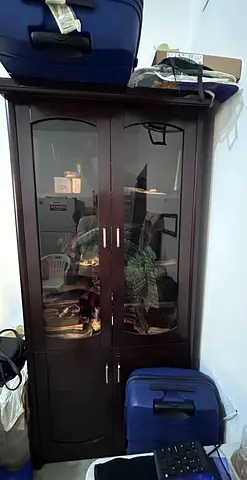 Dark brown wooden cabinet with glass doors - good condition