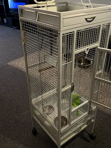 Large white metal bird cage on wheels with play top and accessories