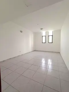 Annual apartment for rent in Sharjah, Al Bu Shaghara area, directly on Al Wahda Street,