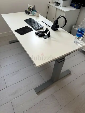 White modern office desk with metal legs -  electronic adjustable height, built in plugs