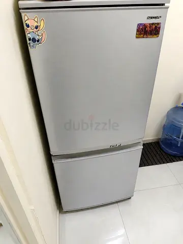 Used silver double-door refrigerator - good working condition