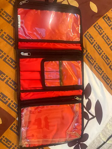 Portable organizer folds flat, multiple pockets