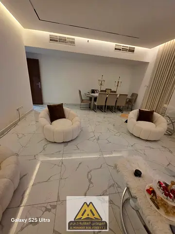 For sale: 2-bedroom apartment with 3 balconies and views in Al Waha Towers, Rashidiya 1, close to all services and main roads.