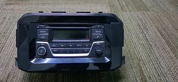 Used Nissan car stereo head unit with fitted dash frame (good condition)