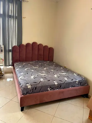 Pink Velvet Upholstered Bed with Scalloped bed frame