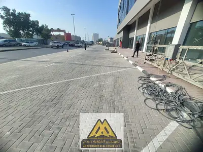 A commercial shop in Ajman Industrial Area 1, in a prime location on Omar Bin Al-Aas Street, characterized by easy access and active commercial traffi