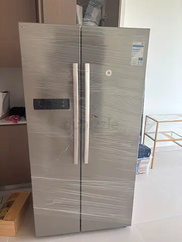 Almost-new double-door refrigerator, stainless steel finish