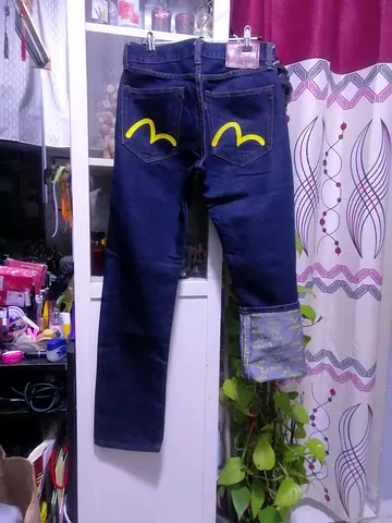 Evisu  denim jeans with yellow back pocket detail - size 30