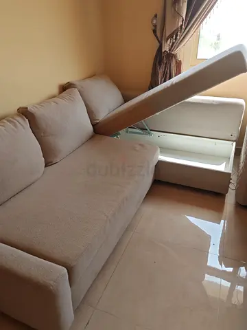 Beige L-shaped storage sofa bed - good condition