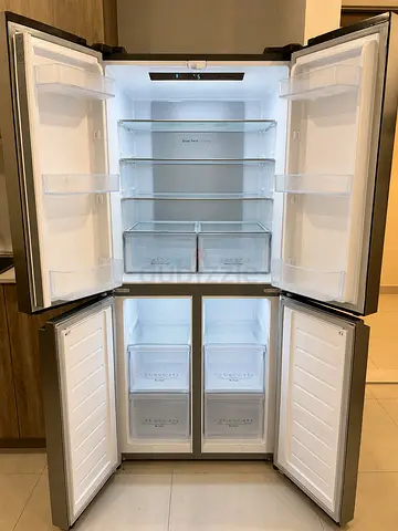 Spacious 4-Door Stainless Steel Refrigerator - Excellent Condition
