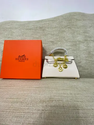Small white handbag with gold hardware and original box
