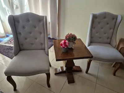 Pair of Grey Wingback Accent Chairs with Wooden Side Table