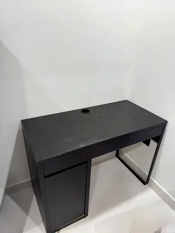 Compact black study desk with storage cabinet and cable hole