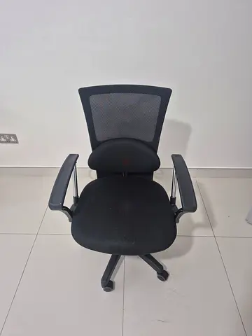 Ergonomic black office chair with mesh back