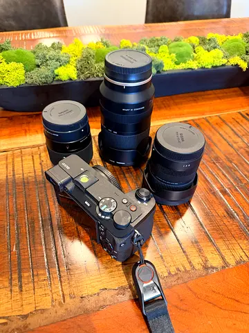 Sony a6700 mirrorless camera with three lenses and Manfrotto bag