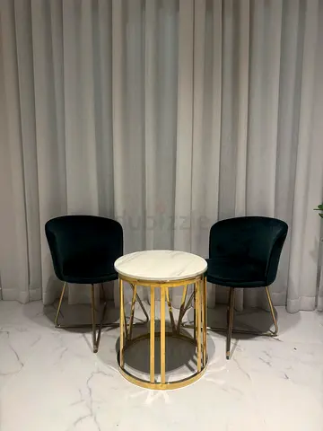 Pair of velvet dining chairs with gold legs + marble-top side table